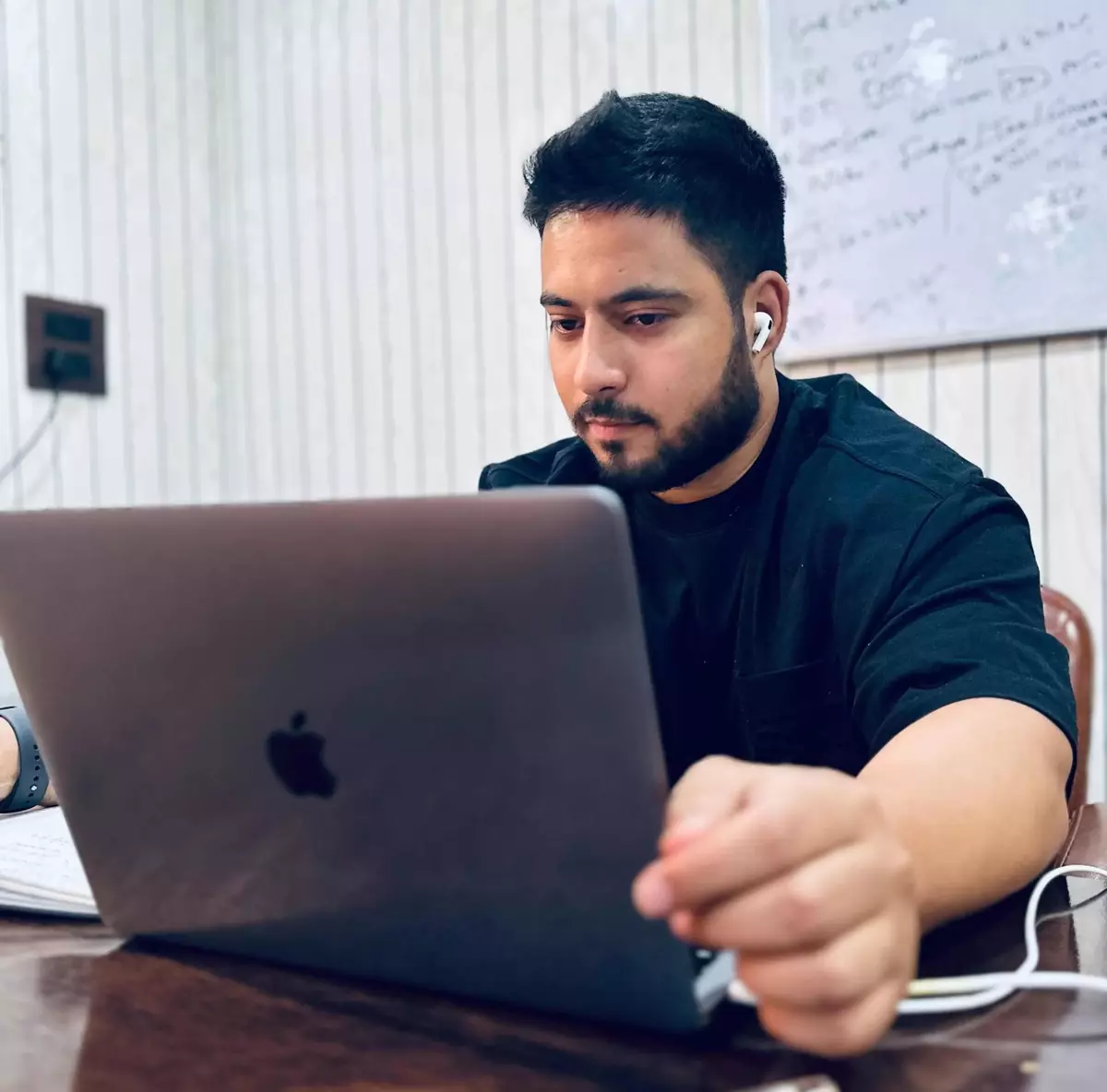 A team member at work on a laptop